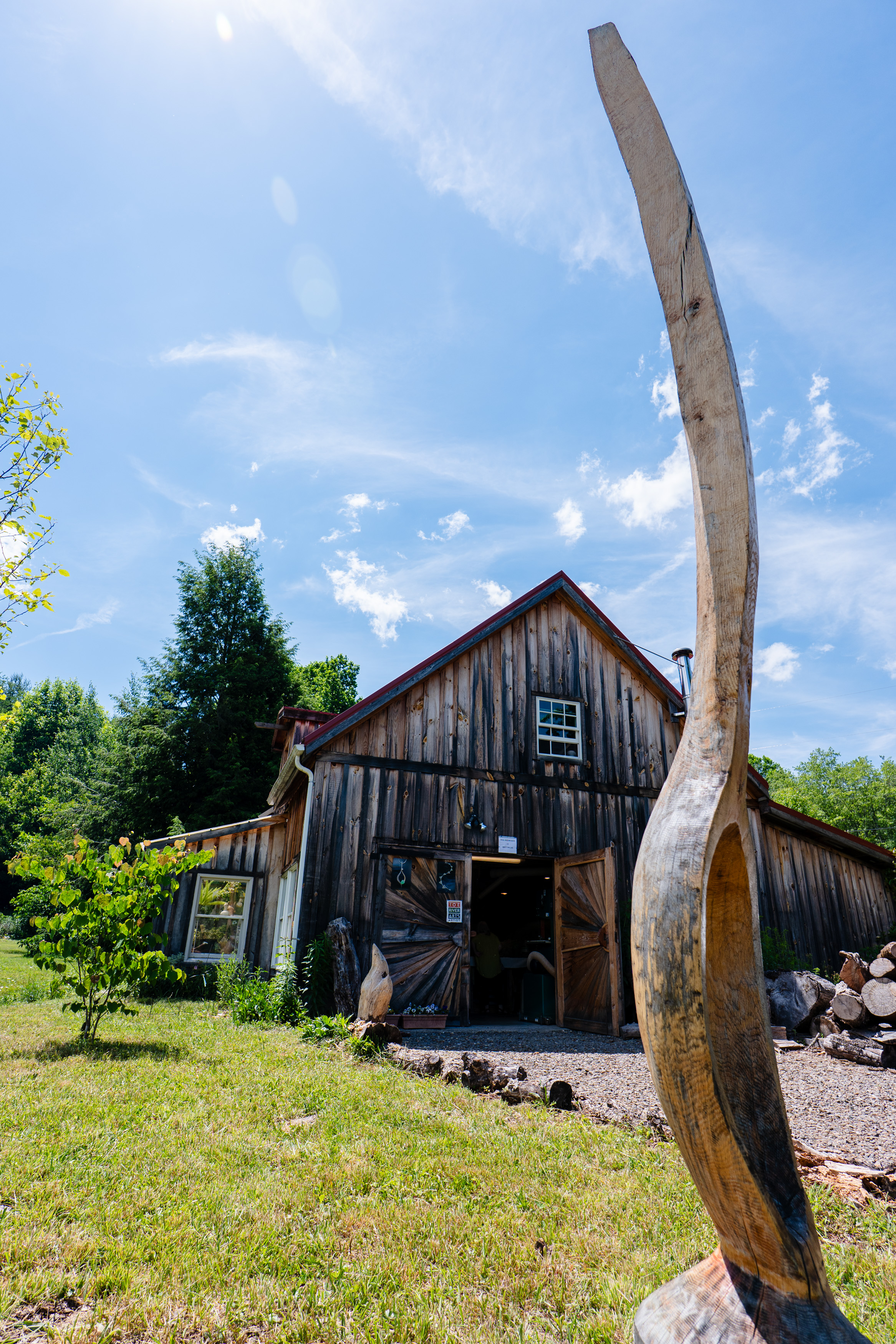 Paul Eisenhauer's woodworking studio with a giant carved wooden spoon outside.