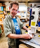 Buzz Coren, owner of Featherwood, demonstrates his woodworking.