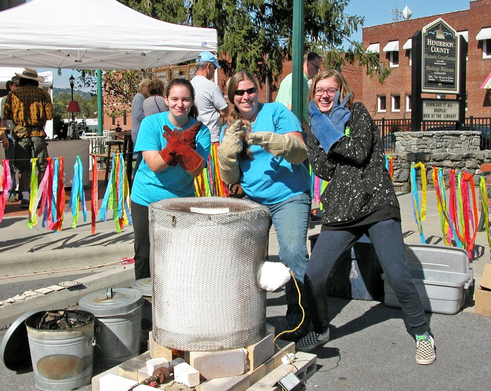 M. Rathsack demonstrates raku pottery firing at Art on Main in Henderson County.