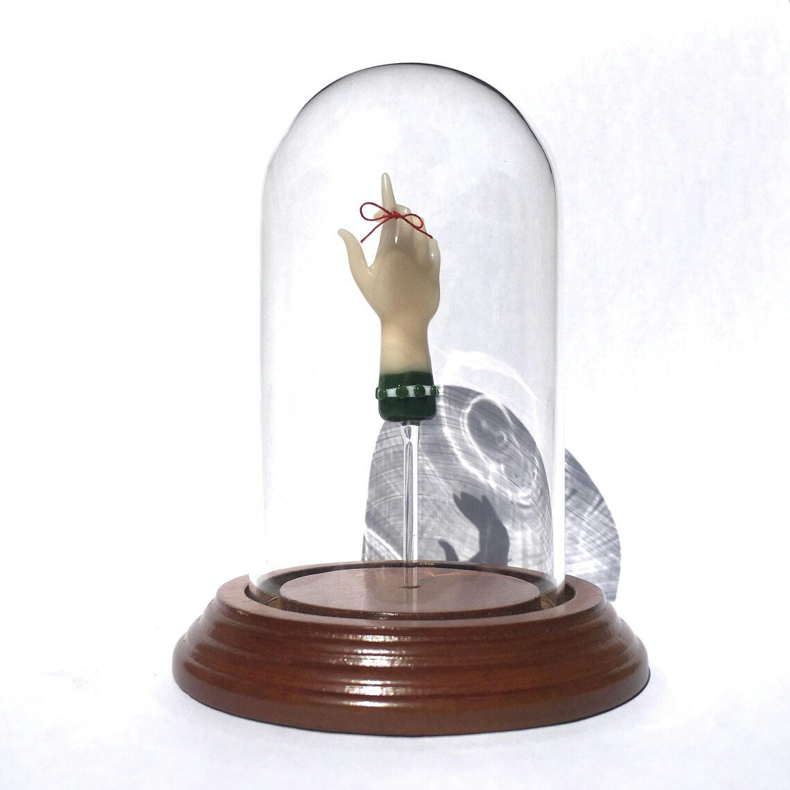 Kit Paulson. “Remember Not to Forget Bell Jar,” 2001. Borosilicate glass, thread, wooden base, glass cloche